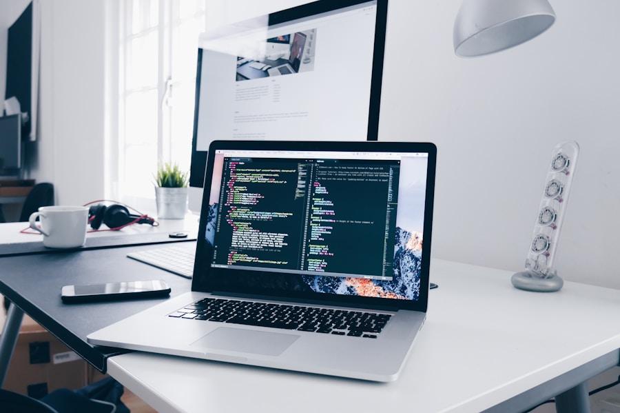 Developer working with code on a laptop